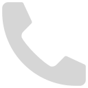 A simple grey telephone handset icon on a light grey background, typically used to represent phone calls or contact information.